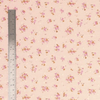 Tissu plumetis coton imprimé fleurs rose layette