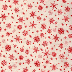 Cretonne de noël aux motifs flocons rouges sur fond écru