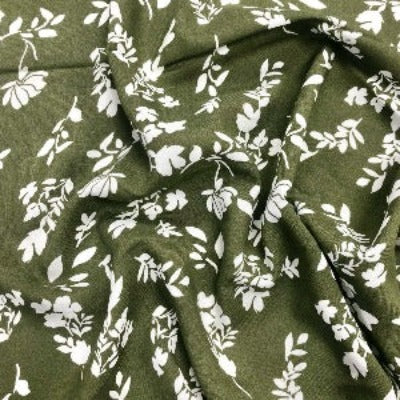 Viscose challis avec des silhouettes de fleurs khaki - La boite à tissus